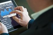 businessmanwithtablet_25192269.jpg